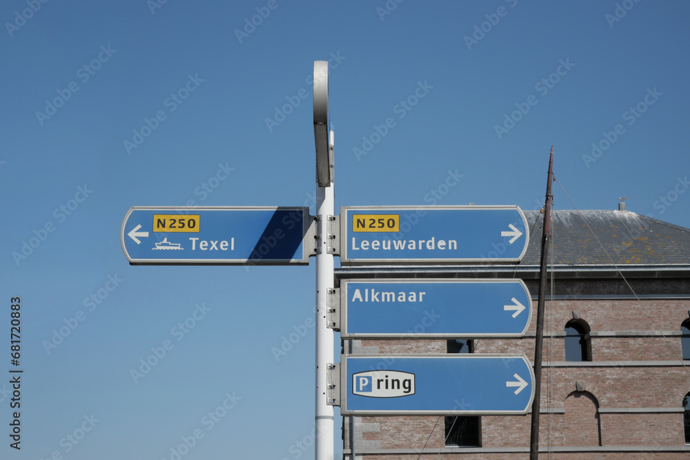 Directional road signs at Willemsoord in Den Helder in the Netherlands, pointing to Texel, Leeuwarden, and Alkmaar Directional road signs at Willemsoord in Den Helder in the Netherlands, pointing to Texel, Leeuwarden, and Alkmaar
