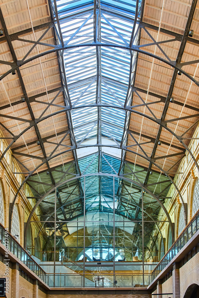 The Ferry Building interior with pointed, blue glass ceiling with glass wall