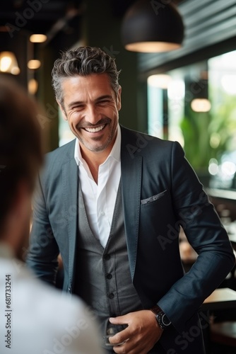 Smiling businessman is talking with friend. Business vibe