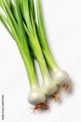 A couple of fresh green onions placed on a clean white surface. This image can be used to depict healthy eating, organic produce, or cooking ingredients.
