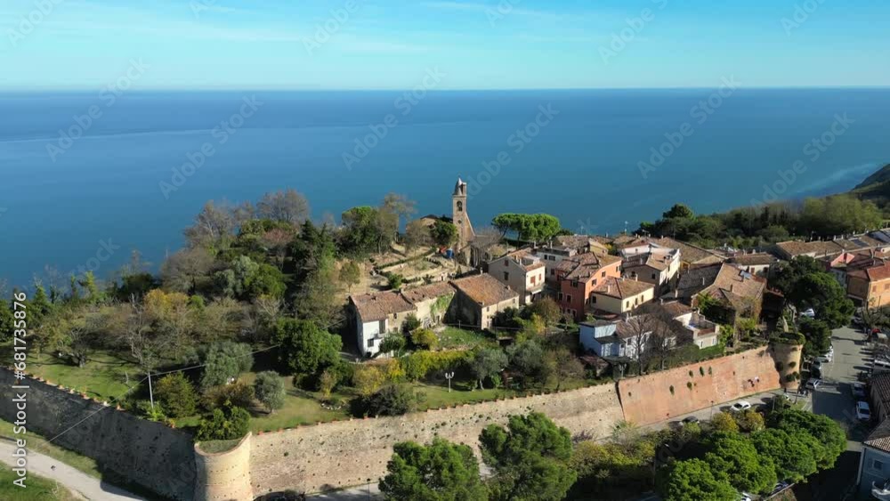 Italy, November 20, 2023 - aerial view of the medieval village of Fiorenzuola di Focara immersed in the San Bartolo park. We are located in the province of Pesaro and Urbino in the Marche region Italy, November 20, 2023 - aerial view of the medieval village of Fiorenzuola di Focara immersed in the San Bartolo park. We are located in the province of Pesaro and Urbino in the Marche region