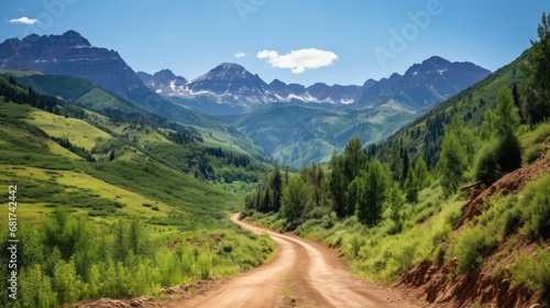 Escape to rustic tranquility! Navigate a rural mountain dirt road, ascending through scenic hills. © pvl0707