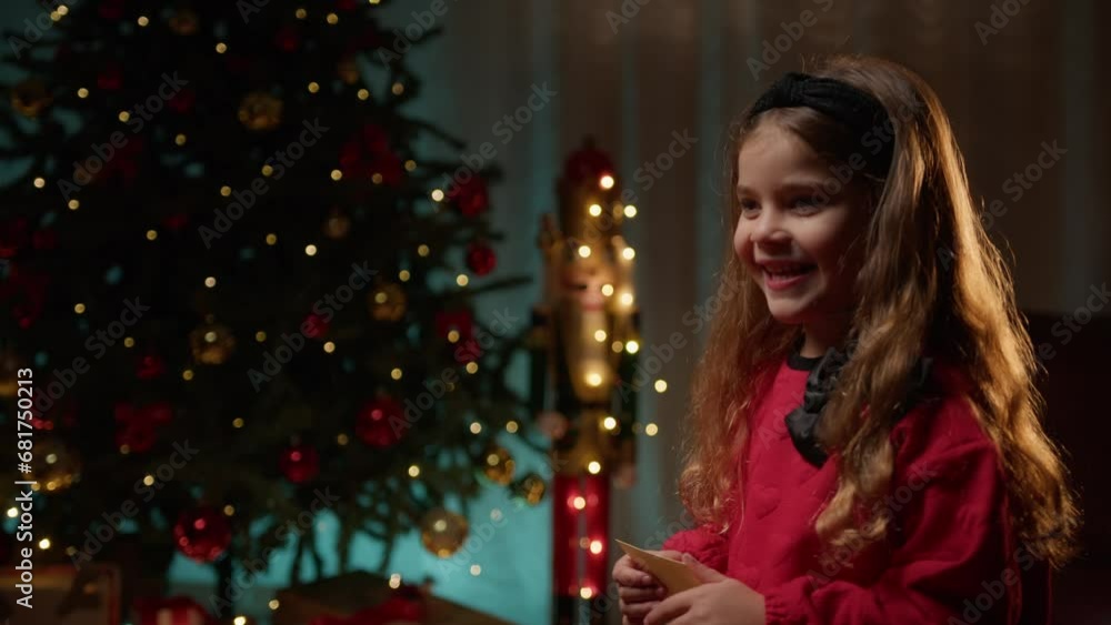 Little girl smiling under the Christmas tree Little girl smiling under the Christmas tree