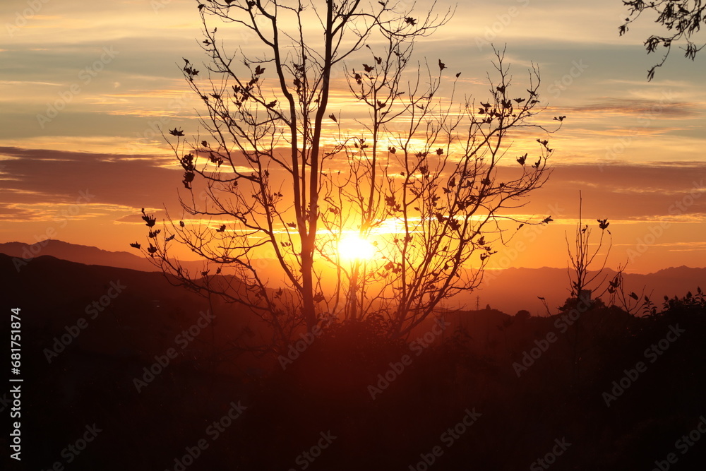 A fabulous landscape of the setting sun through the clouds A fabulous landscape of the setting sun through the clouds