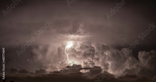 Dramatic dark sky with lightning. Concept on the theme of weather, natural disasters, storms, typhoons, tornadoes, thunderstorms, lightning.