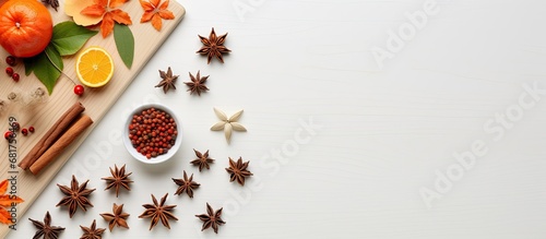 From a top view angle, the white kitchen boasts an artful concept with wooden textures and a splash of orange color from the leafy spices, creating a healthy menu showcasing the art of a red star