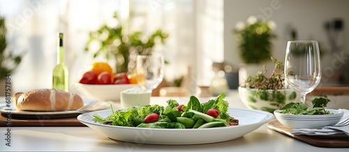 In the pristine white kitchen, a leafy green plate adorned the table, showcasing a gourmet meal. The cooking aroma filled the room as healthy, meaty delicacies awaited their turn to be savored during photo