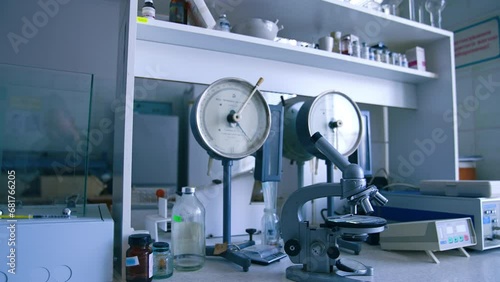 Medical laboratory interior with no people in. Microscope, scales, bottles and beakers in the lab. photo