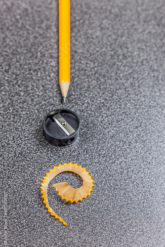 Obraz na płótnie Pencil, pencil sharpener and pencil shaving on desk, close-up w salonie