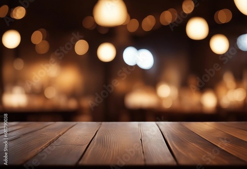 Empty wooden table and blurred background of hall of stage bar or cafe with bokeh lights