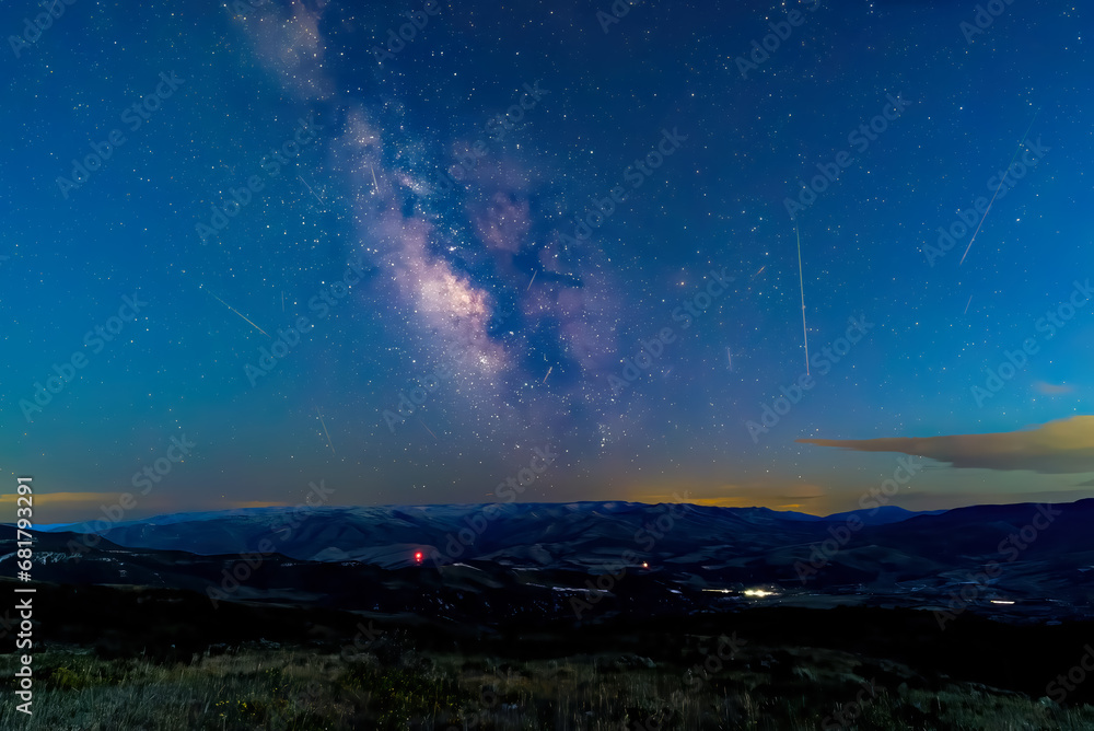 Perseid meteor shower and Milky Way in 2023 over the Wasatch Front mountains in Utah