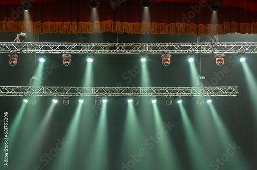 Light from stage lighting equipment in a concert hall photo