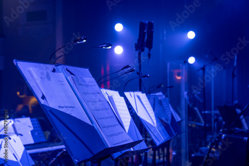 music stands with orchestral notes in the concert hall photo