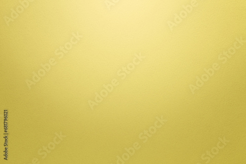 Textured bright yellow paper background with light effect. High resolution full frame background with copy space.