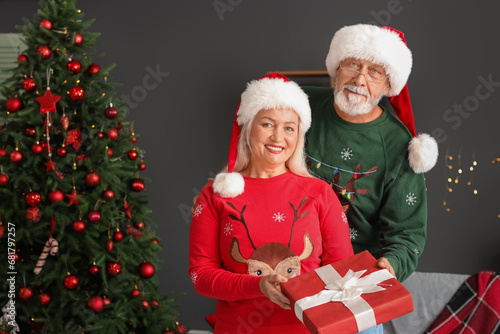 Happy mature couple with Ch...