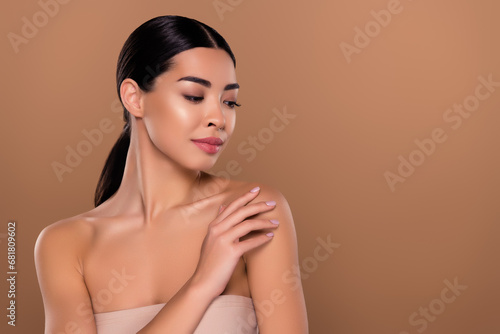 Portrait of gentle touch her shoulder girlfriend posing photographer without makeup isolated on beige color background