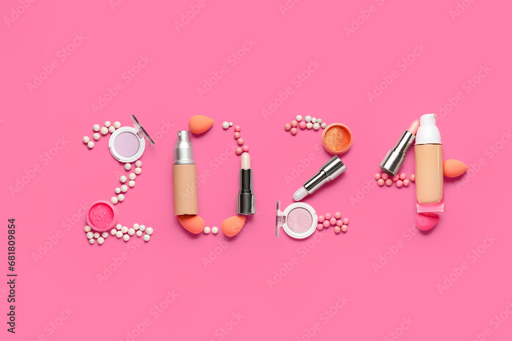 Figure 2024 made of different decorative cosmetics on pink background