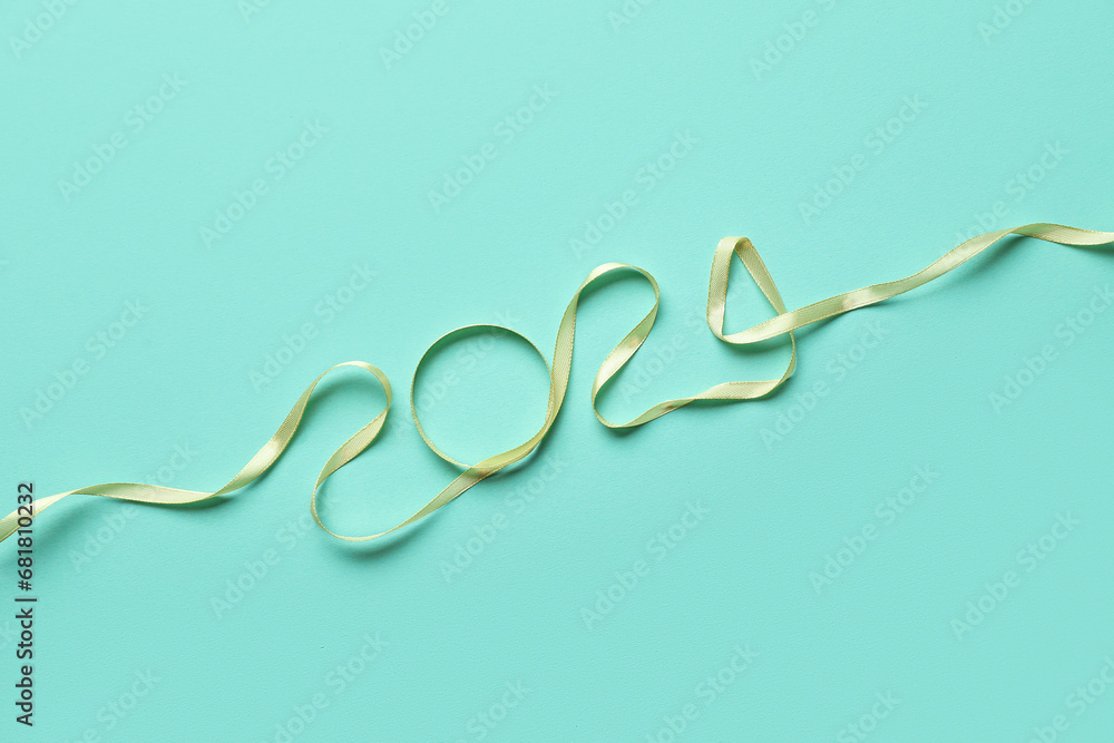 Figure 2024 made of ribbon on color background Figure 2024 made of ribbon on color background