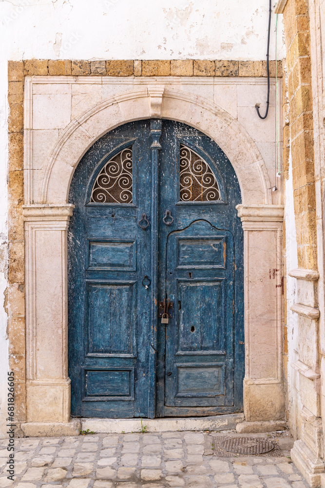 A blue keyhole, or Moorish, arch door on a house near the Tunis Souk.