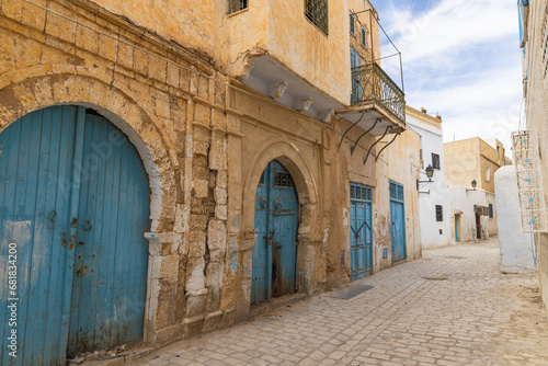 Blue doors along a street in the city of Kairouan.