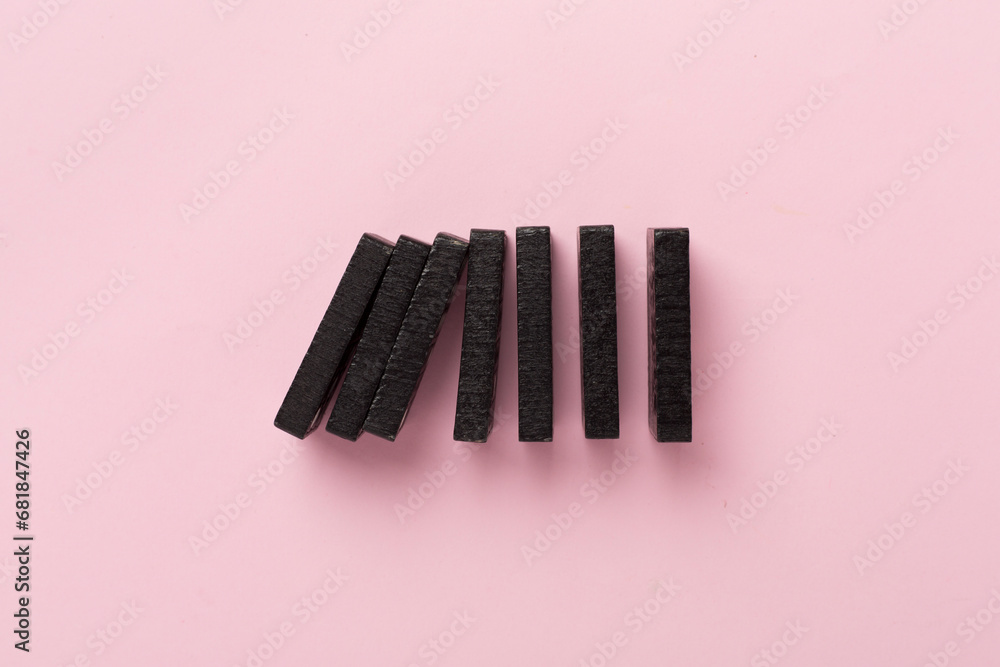 Black domino tiles on color background, top view Black domino tiles on color background, top view