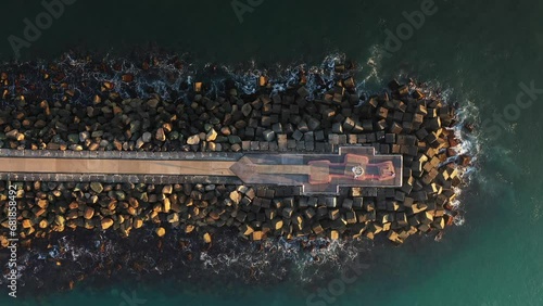 Aerial top down descent over the tip of Southport Spit breakwall. Gold Coast, Australia. photo
