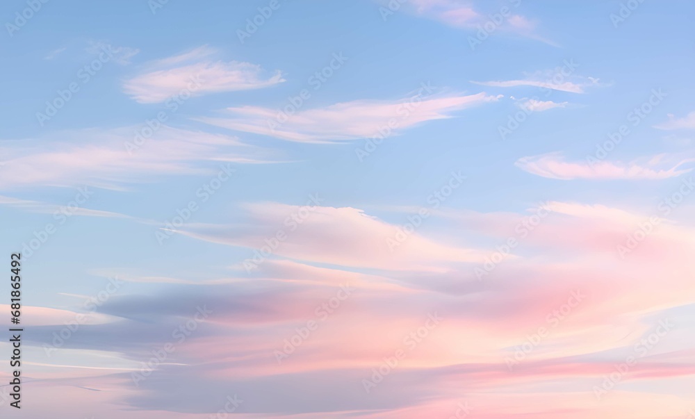 淡い青空とピンクにグラデーションする雲