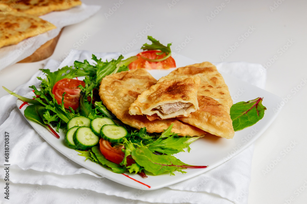 Russian cuisine is tasty chebureki fried dough with meat. Russian cuisine is tasty chebureki fried dough with meat.