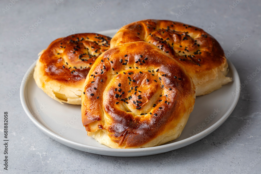 Traditional delicious Turkish phyllo stuffed with spinach, cheese (Turkish name; Gul borek or gul boregi) Rose shaped pastry. Traditional delicious Turkish phyllo stuffed with spinach, cheese (Turkish name; Gul borek or gul boregi) Rose shaped pastry.