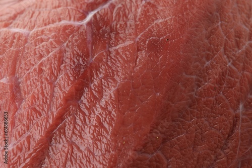 Piece of raw beef meat as background, closeup