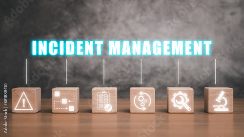 Incident management concept, Wooden block on desk with incident management icon on virtual screen. photo
