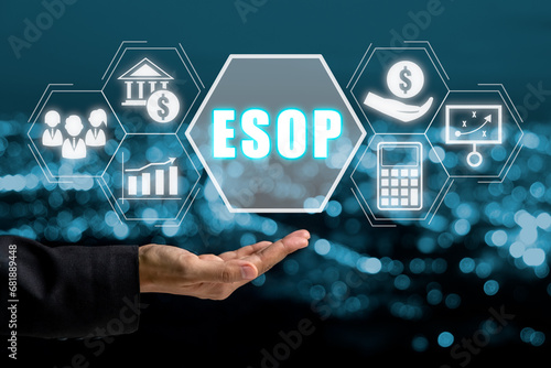 ESOP, Employee Stock Ownership Plan concept, Business person hand holding Employee Stock Ownership Plan icon on virtual screen. photo