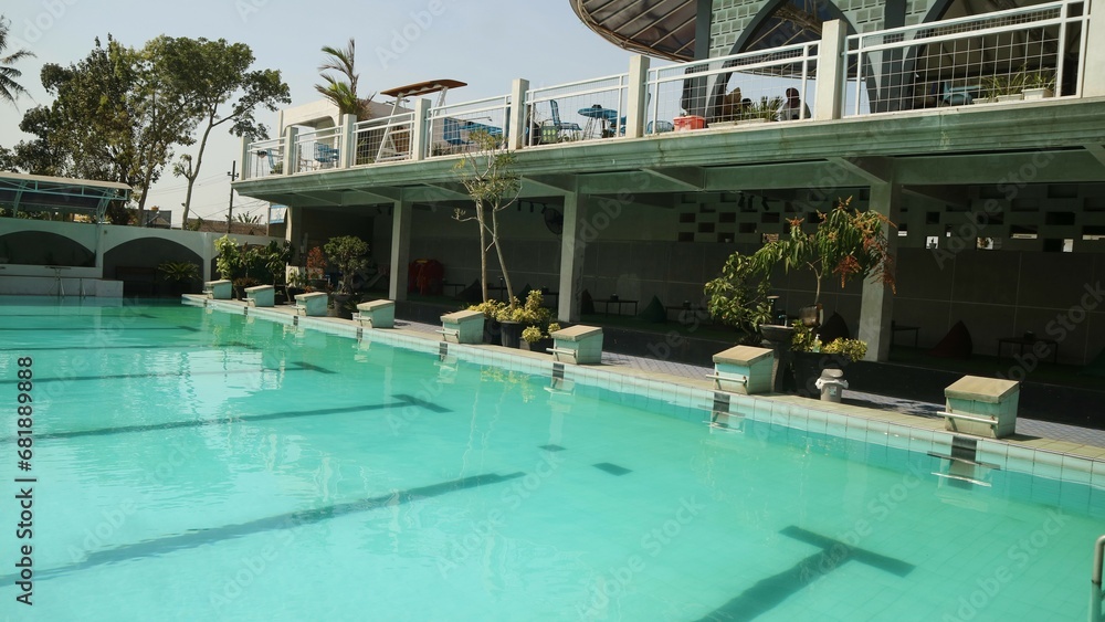 Top view swimming pool with clear water on sunny background