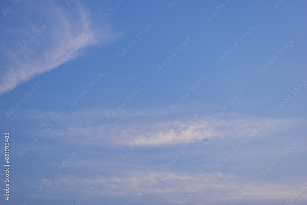 beautiful blue sky and white fluffy cloud with sunrise in the morning, natural background