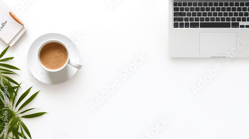 top view of modern workspace with laptop computer office supplies and coffee cup on white desk photo