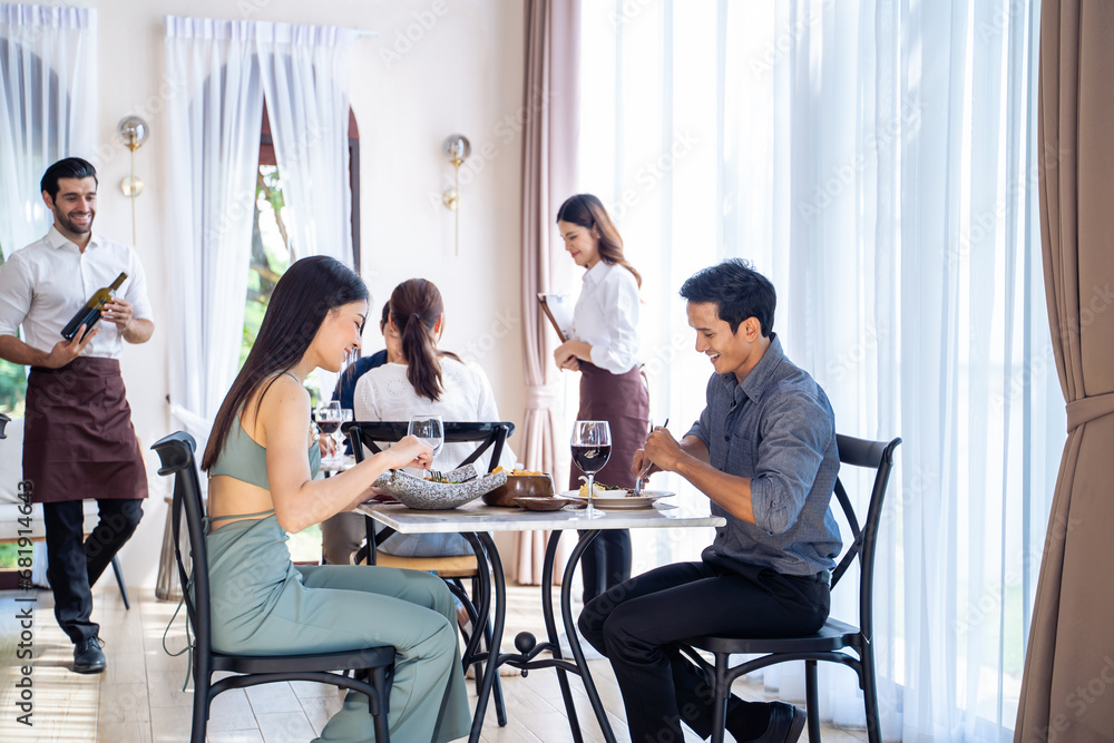 Asian young lovely couple customer having dinner in restaurant together. Asian young lovely couple customer having dinner in restaurant together.