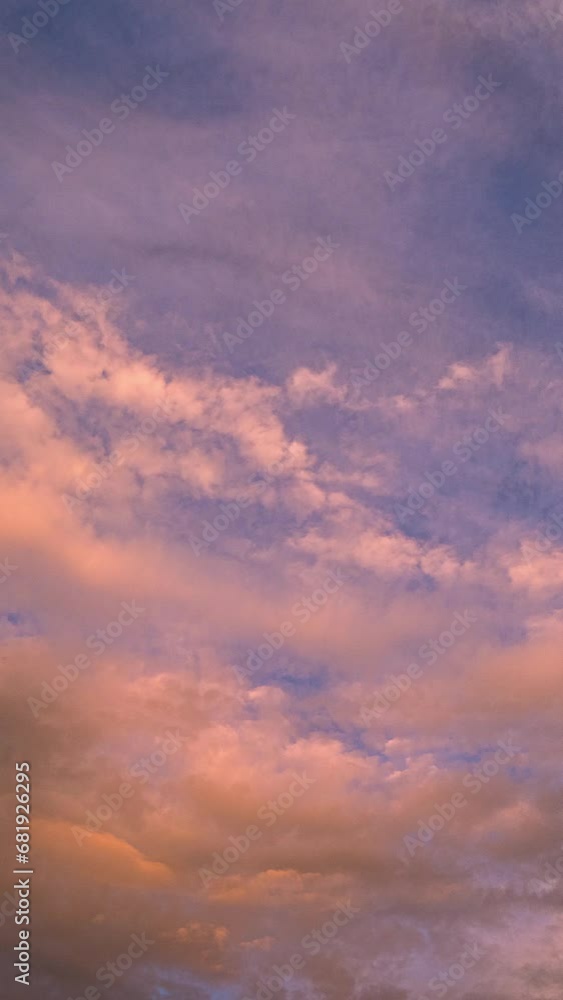 Vertical Timelapse of clouds moving and changing colors during sunset in the sky over Utah Valley. Vertical Timelapse of clouds moving and changing colors during sunset in the sky over Utah Valley.