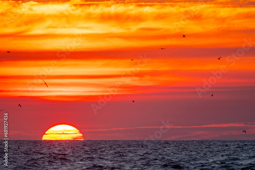 Sunrise with Orange Sky, sun on Left © Tom Ramsey