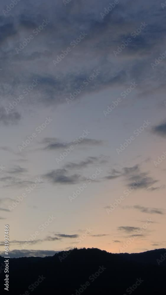 Twilight and dawn sky with cumulus cloud vertical time lapse in an evening. Twilight and dawn sky with cumulus cloud vertical time lapse in an evening.