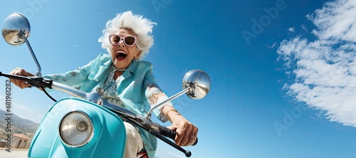 An elderly cheerful woman with gray hair rides a blue scooter and smiles. Generated by AI. photo