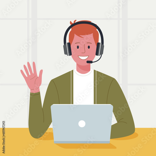 Friendly male customer service representative with a headset working on a laptop in a bright office environment