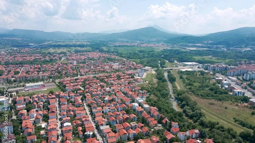 Aerial view of river Nisava, city of Nis and mountains surrounding city photo