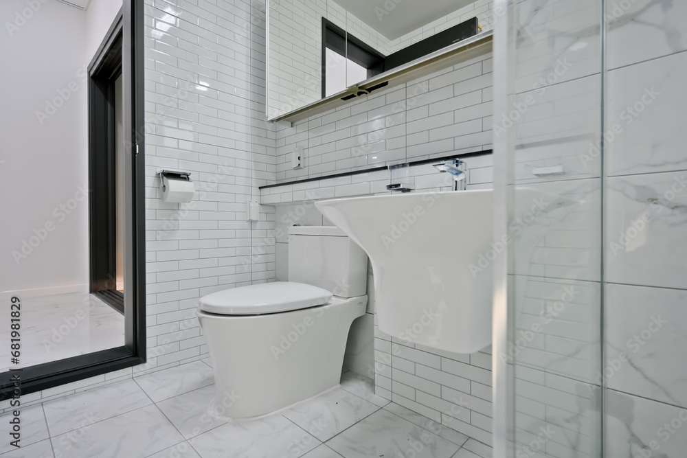 A toilet, sink, and shower area with a glass partition are the most common bathroom layouts A toilet, sink, and shower area with a glass partition are the most common bathroom layouts