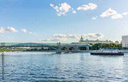 View of the Moscow river embakment, Pushkinsky bridge and cruise ships at sunset. photo