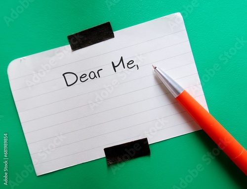 Note on green background with handwritten text DEAR ME, concept of self compassion by writing compassionate note to self, beat negative inner voice