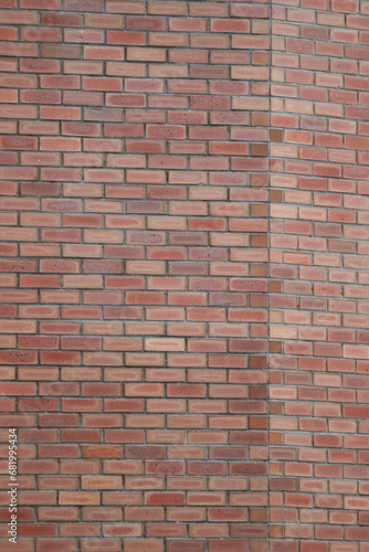 Fill in a photo frame of a neatly arranged brick wall  suitable for a house facade