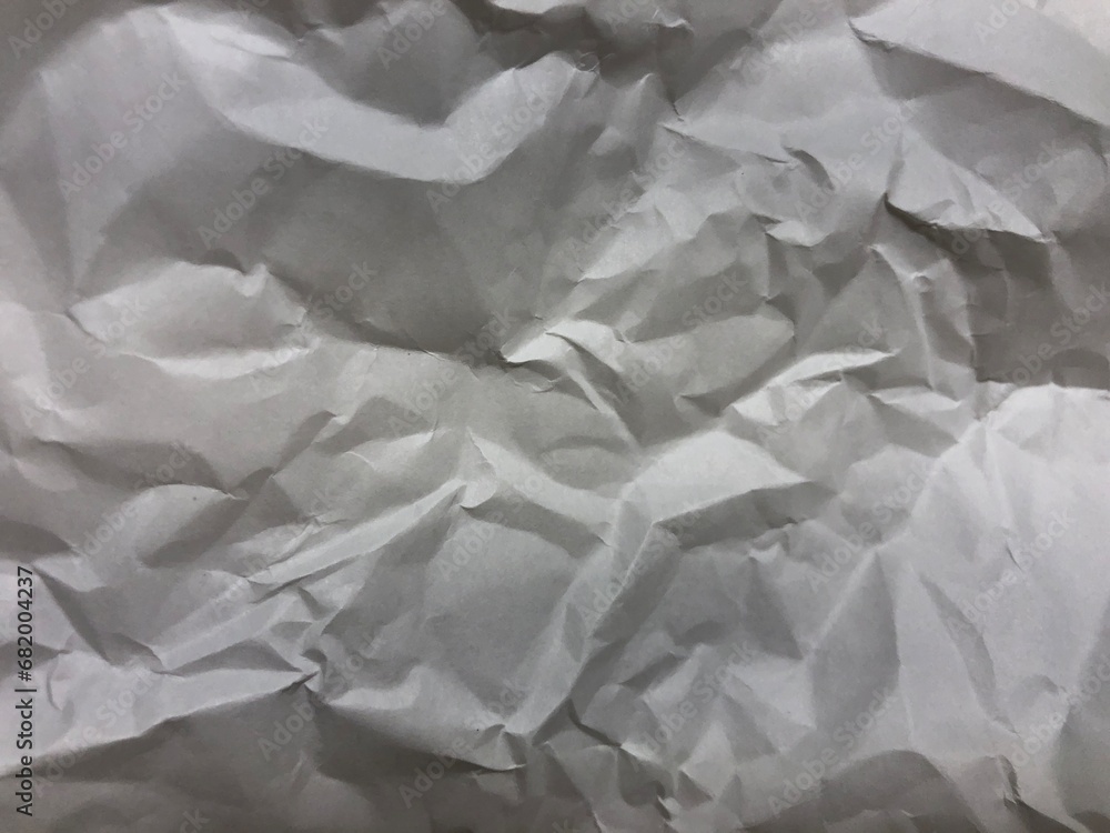 Fototapeta premium 丸めて戻したしわくちゃの用紙の写真