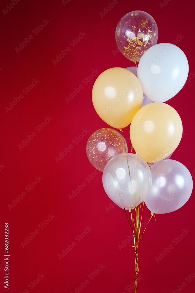 A bunch of light balloons on a red background. Vertical Photo Space for Text A bunch of light balloons on a red background. Vertical Photo Space for Text