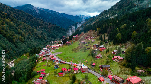 General landscape view of Ayder Plateau in Rize. Ayder Plateau has a wide meadow area with excellent nature views and wooden chalets. Rize, Camlihemsin, Turkey. photo