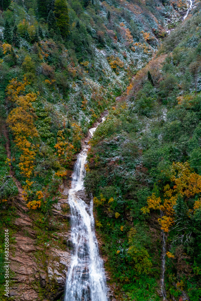 Ayder Plateau, Rize, Turkey. Waterfall in autumn. The water flowing naturally between the stones flows in the form of a waterfall. Scenic view of the waterfall in the forest. Ayder Plateau, Rize, Turkey. Waterfall in autumn. The water flowing naturally between the stones flows in the form of a waterfall. Scenic view of the waterfall in the forest.